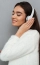 side-view-pleased-brunette-woman-sweater-headphones (2)